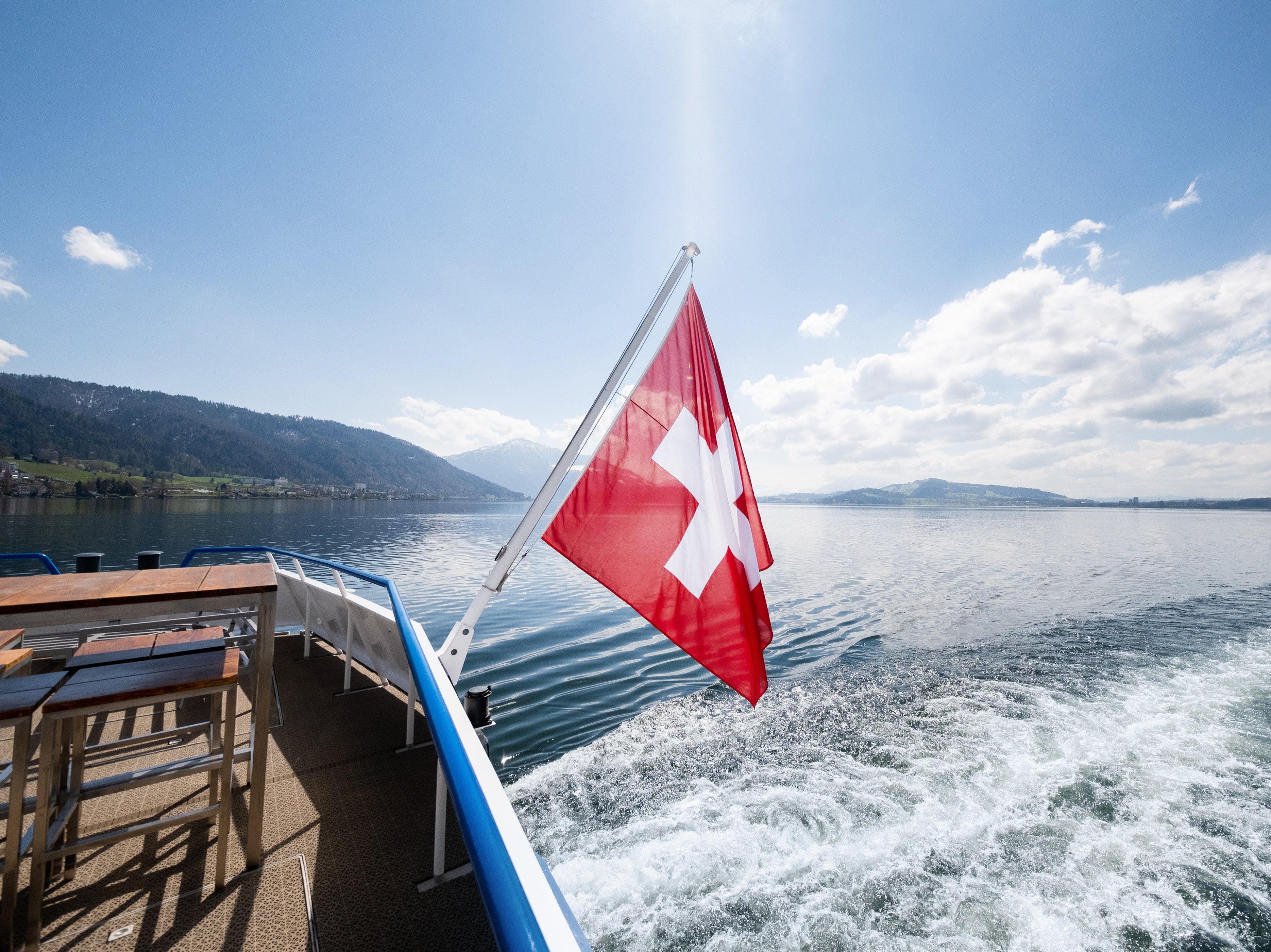 Swiss flag Flag waving at the stern of the MS Rigi on the lake