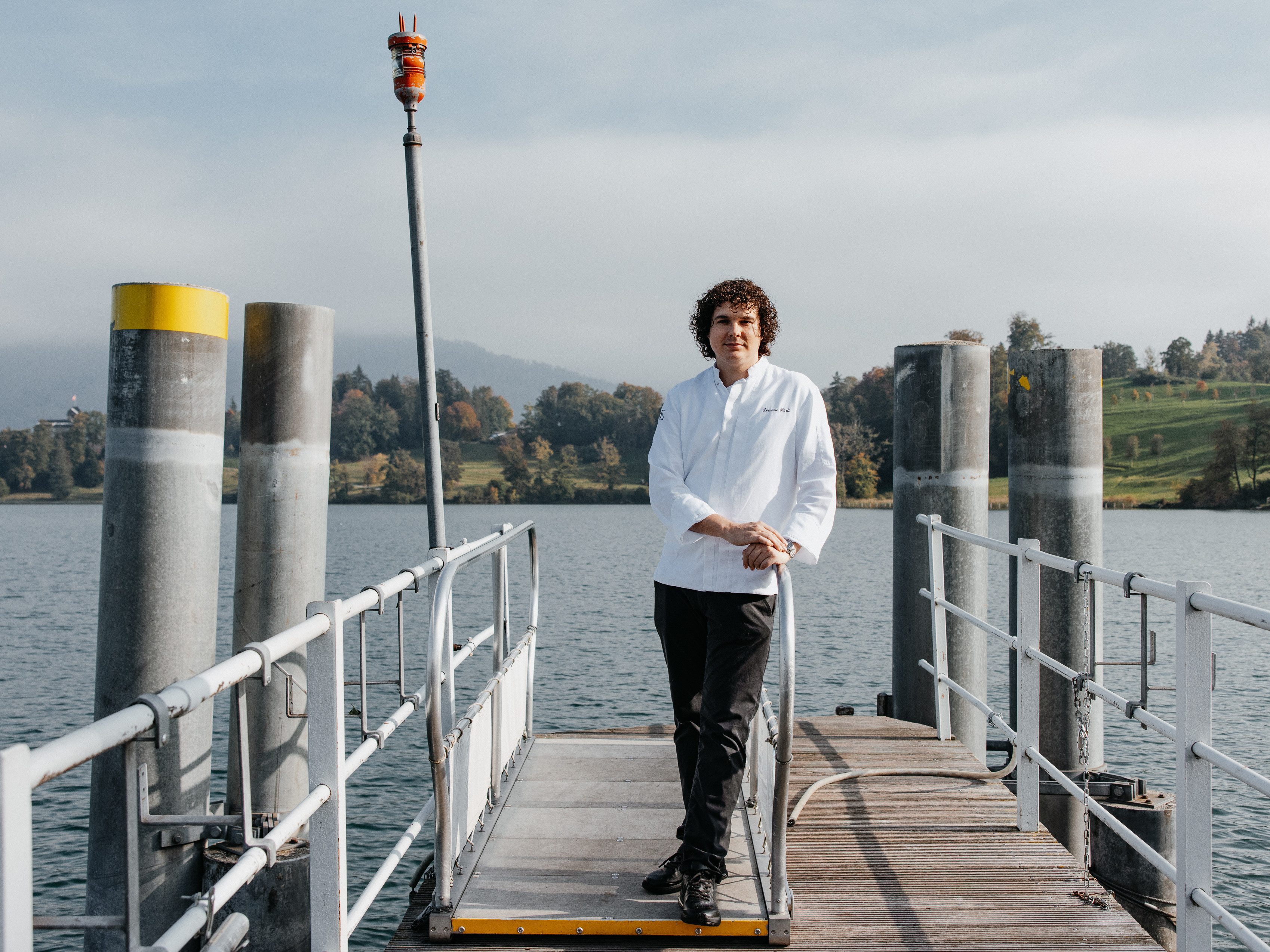 Chef Dominic Bürli stands on the jetty